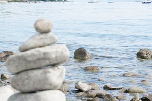 Stack of perfectly balanced stones on a beach.